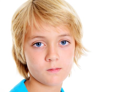 blond boy looking sad in front of white background