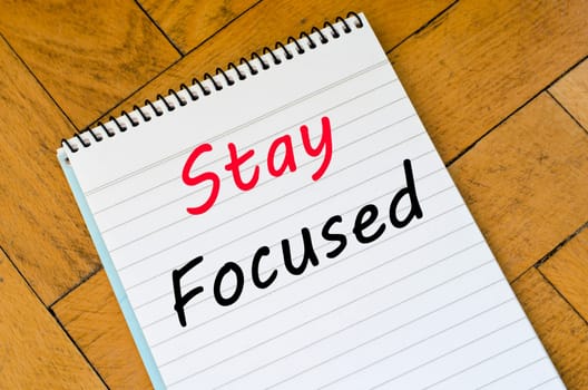 Stay focused text concept write on notebook