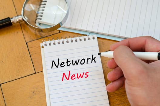 Network news text concept write on notebook