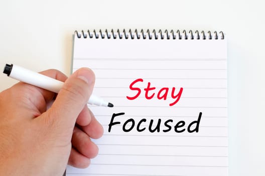 Stay focused text concept write on notebook