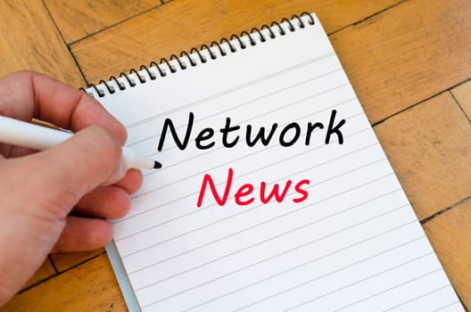 Network news text concept write on notebook