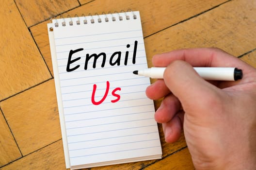 Email us text concept write on notebook