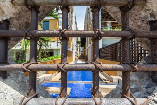 Looking through a barred off window in Cartagena, Colombia