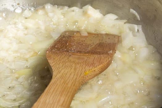 Frying chopped onion in a pan
