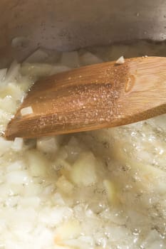 Frying chopped onion in a pan