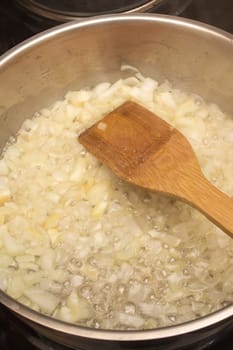 Frying chopped onion in a pan