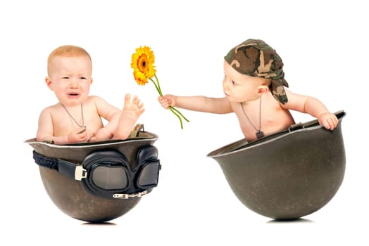 Cute baby girl duplicated inside an old military helmet