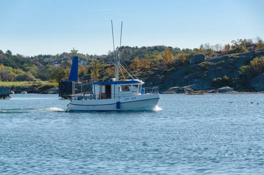 one small fishingboat on the swedish westcoast going out and fish