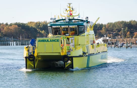 one ambulace car on a ambulance boat on transport
