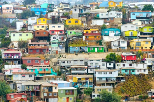 Brightly-colored houses tumble merrily down the sheer hills of Valparaiso, Chile