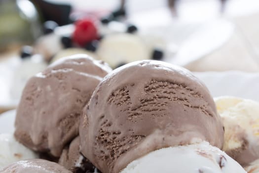 Scoops of chocolate ice cream in the white plate