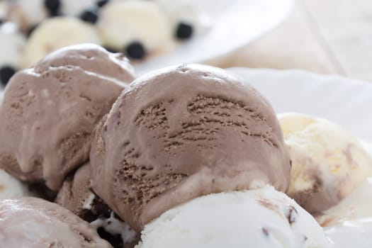 Scoops of chocolate ice cream in the white plate