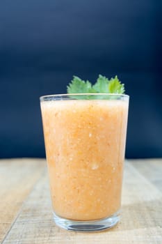 Fresh lemonade with ginger decorated with green celery leaves