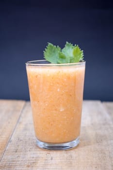 Fresh lemonade with ginger decorated with green celery leaves