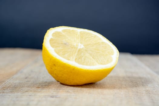 Lemon on the woden table with dark background
