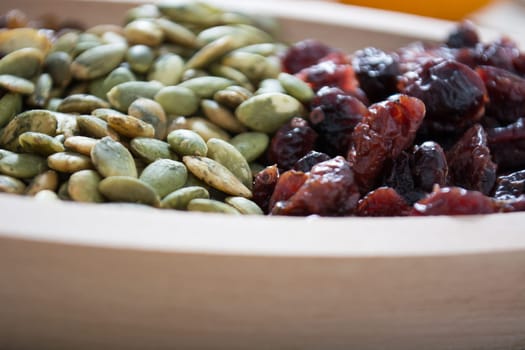 Dry fruit with pumpkin seed in the wooden bowl