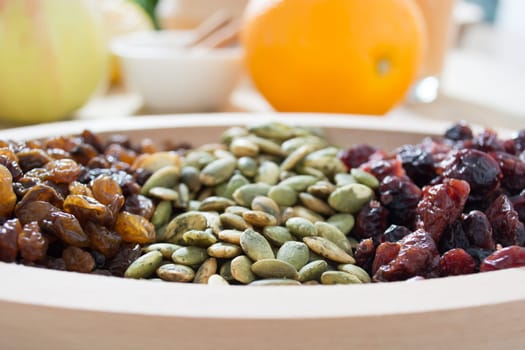 Dry fruit with pumpkin seed in the wooden bowl