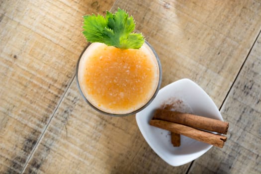 Healthy ginger drink served with cinnamon sticks