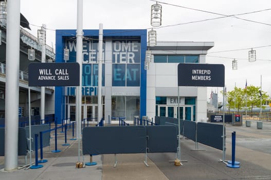 NEW YORK CITY - MAY 1, 2016: Entrance of the Intrepid museum in Manhattan. New York City’s Intrepid Sea, Air & Space Museum Complex is an educational and cultural non-profit institution centered on the aircraft carrier Intrepid