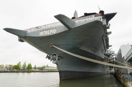 NEW YORK CITY - MAY 1, 2016: Low angle view of the uss intrepid aircraft carrier in Manhattan. The ship is part of the Intrepid Sea, Air & Space Museum and was build in 1943