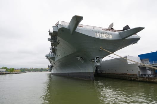 NEW YORK CITY - MAY 1, 2016: Low angle view of the uss intrepid aircraft carrier in Manhattan. The ship is part of the Intrepid Sea, Air & Space Museum and was build in 1943