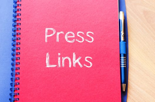 Press links text concept write on notebook