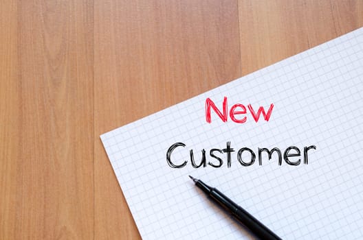 New customer text concept write on notebook