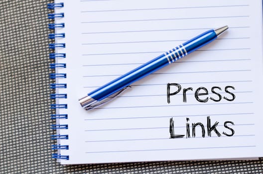 Press links text concept write on notebook