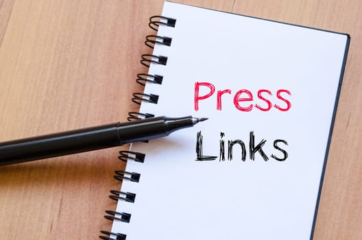 Press links text concept write on notebook