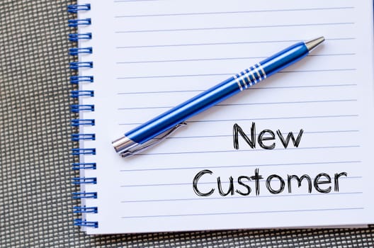 New customer text concept write on notebook