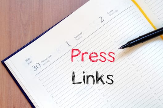 Press links text concept write on notebook