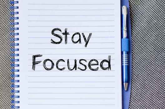Stay focused text concept write on notebook