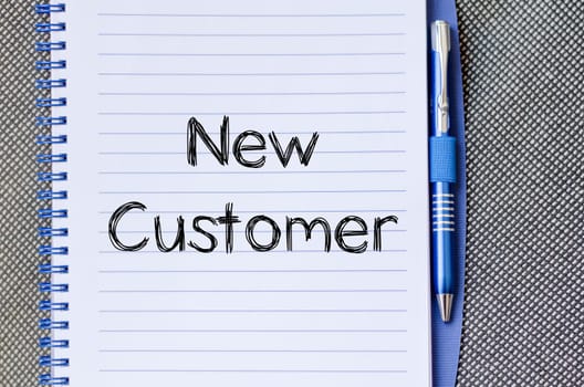New customer text concept write on notebook