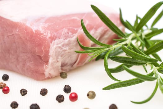 Rosemary and pork saddle raw with peppercorns