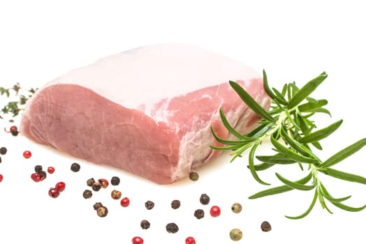 Iberico pork meat raw with rosemary on a white background
