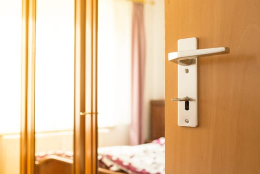 Door from the bedroom with door handle,key and closet is open