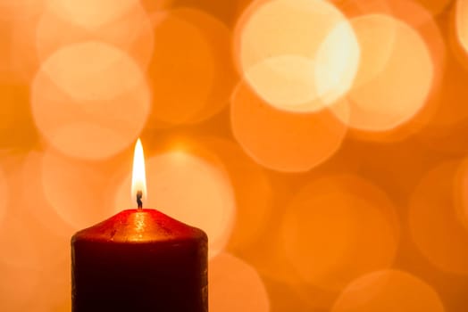 Close-up candle does burn and lights as bokeh