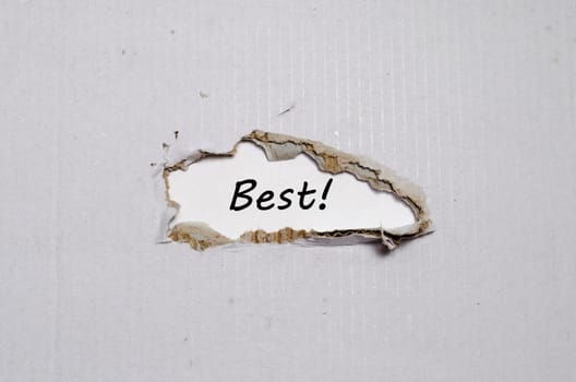 The word best appearing behind torn paper