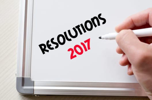 Human hand writing resolutions 2017 on whiteboard
