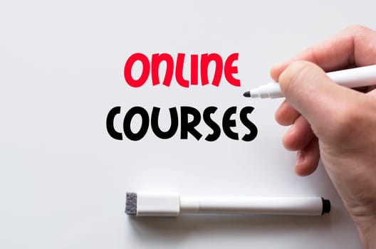 Human hand writing online courses on whiteboard