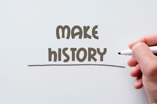 Human hand writing make history on whiteboard
