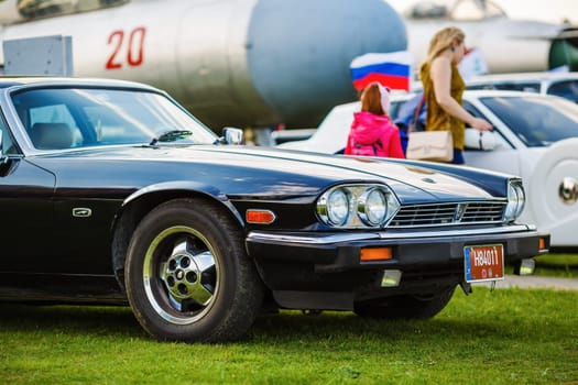 MINSK, BELARUS - MAY 07, 2016: Close-up photo of black Jaguar XJS 1984 model year. Close-up of old black classic retro car. Selective focus.