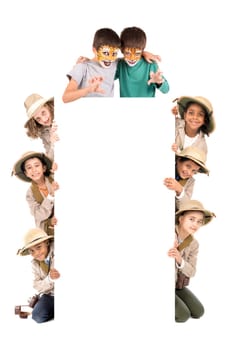 Children's group in safari clothes and animal face-paint over a white board