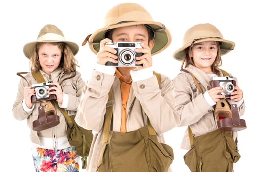 Group of kids having fun with cameras in safari clothes