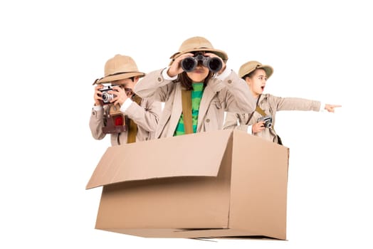 Children in a cardboard box playing Safari