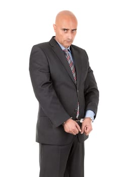 Businessman in handcuffs isolated in white background