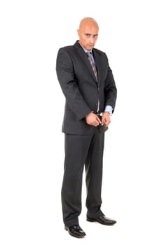 Businessman in handcuffs isolated in white background
