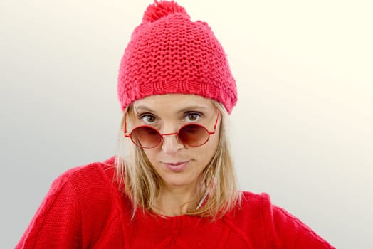 fashion blonde woman with red  sweater and winter hat