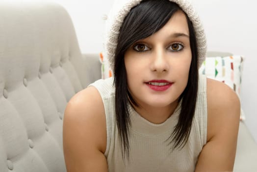 portrait of a pretty young brunette with winter hat