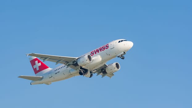 Munich, Germany - May 6, 2016: Plane Airbus A319-112 of Swiss International Air Lines flag carrier take off from Munich international airport and gains altitude